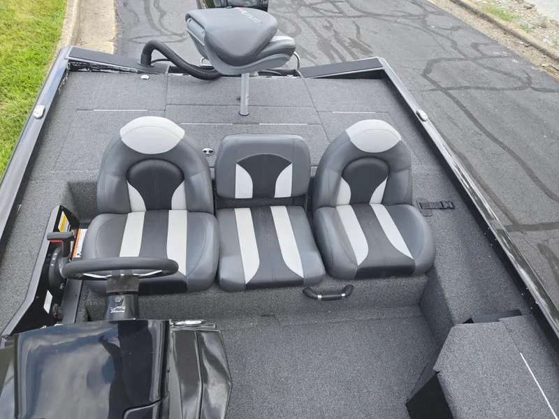 Slide: The Image of 2022 Vexus AVX181 boat interior with gray and black seating, steering wheel, and elevated seat. - 20