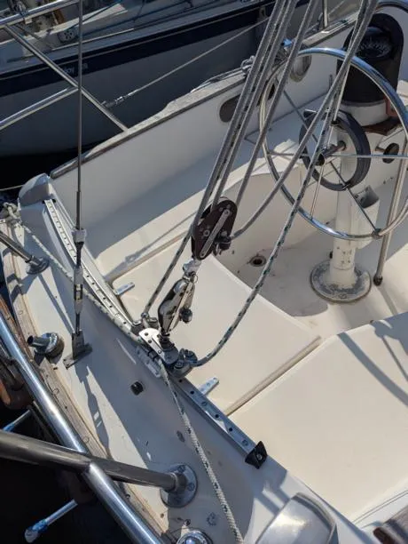 Slide: The Image of 1979 Sabre 28-2 sailboat cockpit with steering wheel and rigging details. - 20