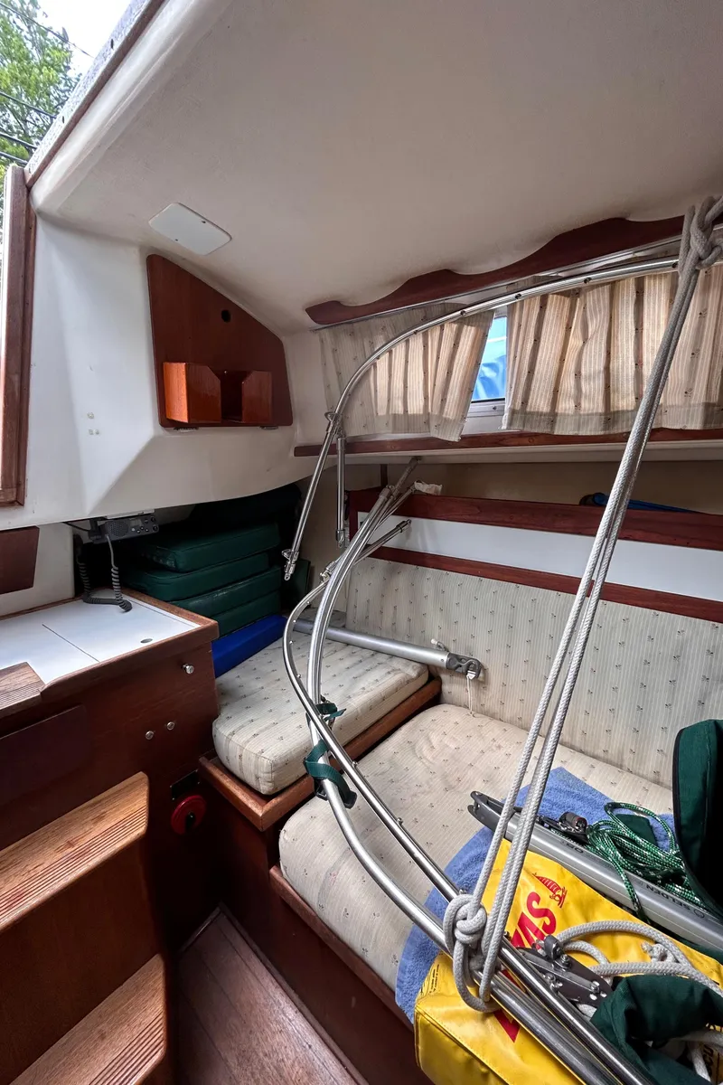 Slide: The Image of Interior of a 1979 Sabre 28-2 sailboat with seating and storage. - 25
