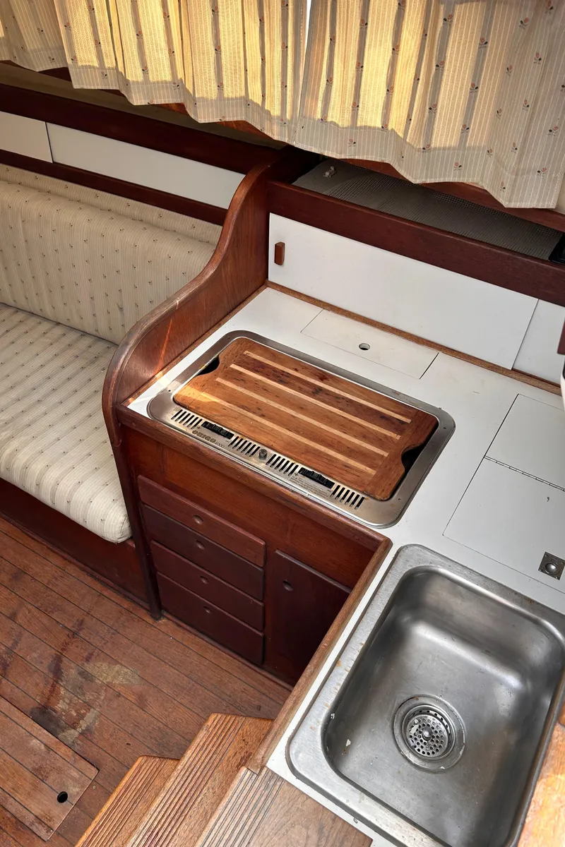 Slide: The Image of 1979 Sabre 28-2 sailboat interior galley with sink and stove. - 31