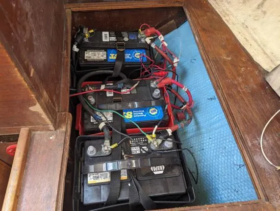 Slide: The Image of Three marine batteries in a 1979 Sabre 28-2 sailboat compartment. - 37