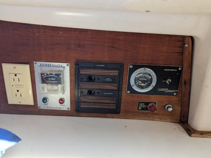 Slide: The Image of Electrical panel of a 1979 Sabre 28-2 boat with outlets and gauges. - 39