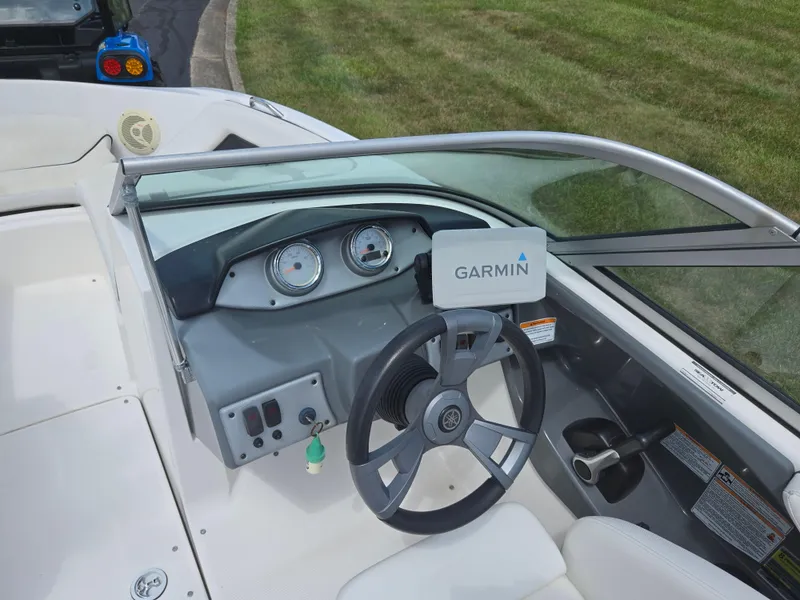 Slide: The Image of 2015 Yamaha SX190 boat dashboard with Garmin navigation system and steering wheel. - 12