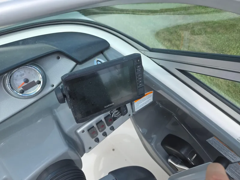 Slide: The Image of 2015 Yamaha SX190 boat dashboard with Garmin display and controls. - 13
