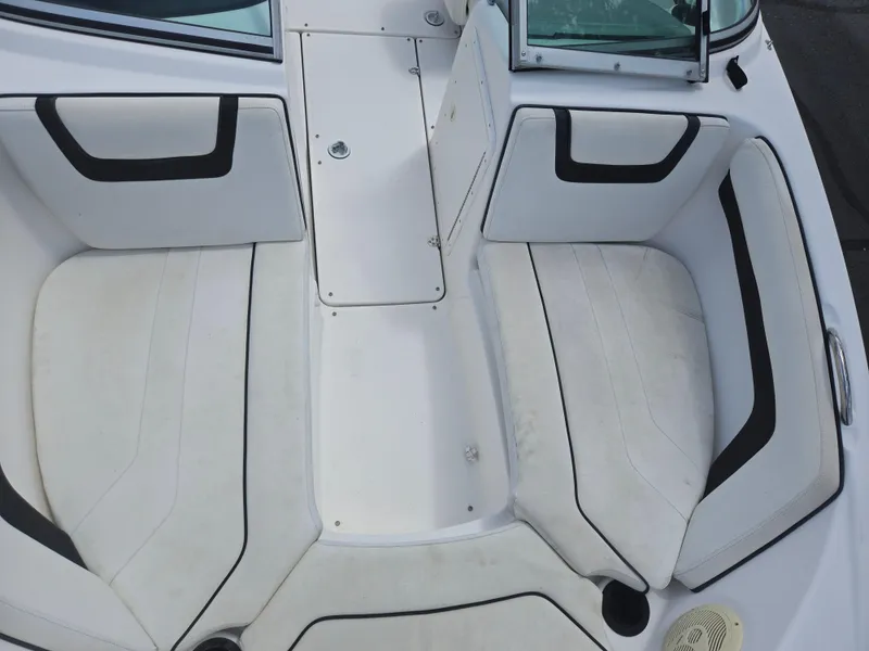 Slide: The Image of 2015 Yamaha Boats SX190 interior seating with white and black upholstery. - 19
