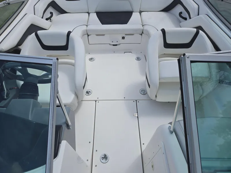 Slide: The Image of 2015 Yamaha Boats SX190 interior with white seating and steering wheel. - 21