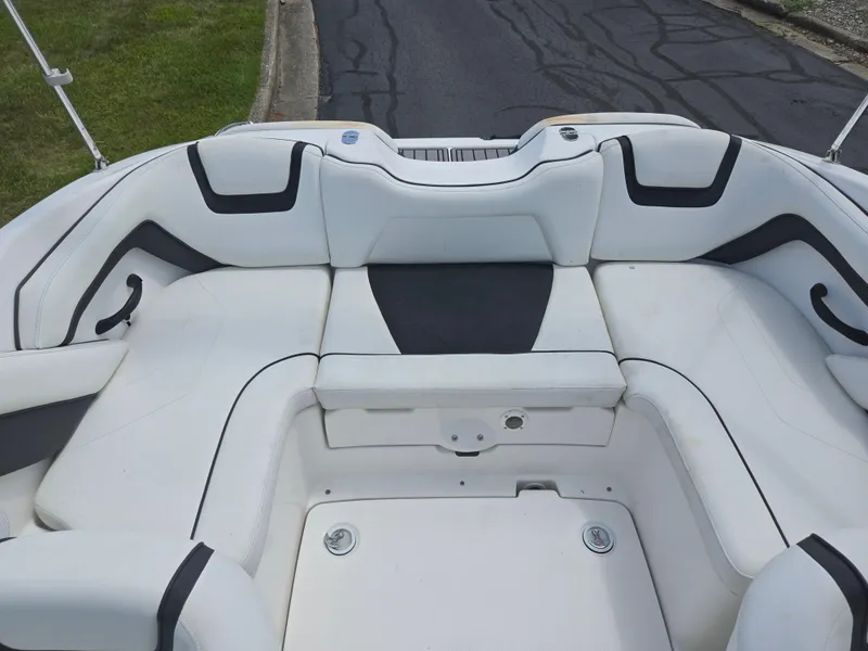 Slide: The Image of 2015 Yamaha SX190 boat interior with white seating and black accents. - 22