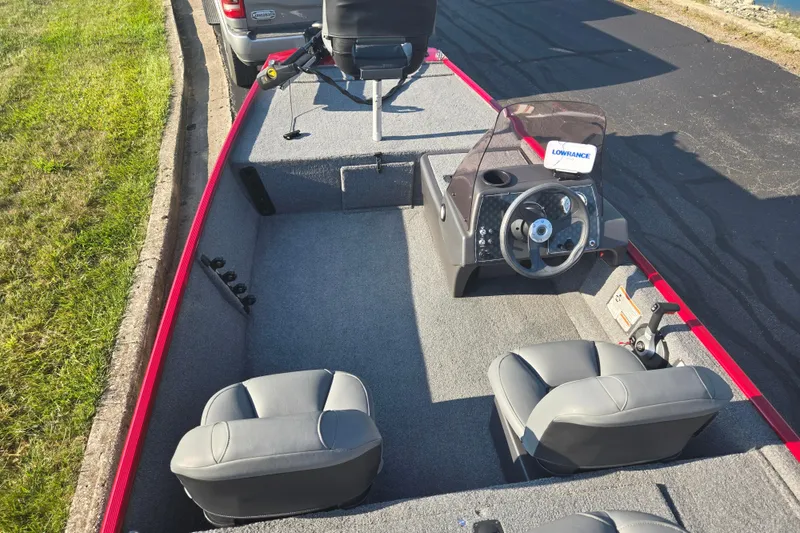 Slide: The Image of 2023 Tracker Bass Tracker Classic XL boat interior with steering console and seating. - 11