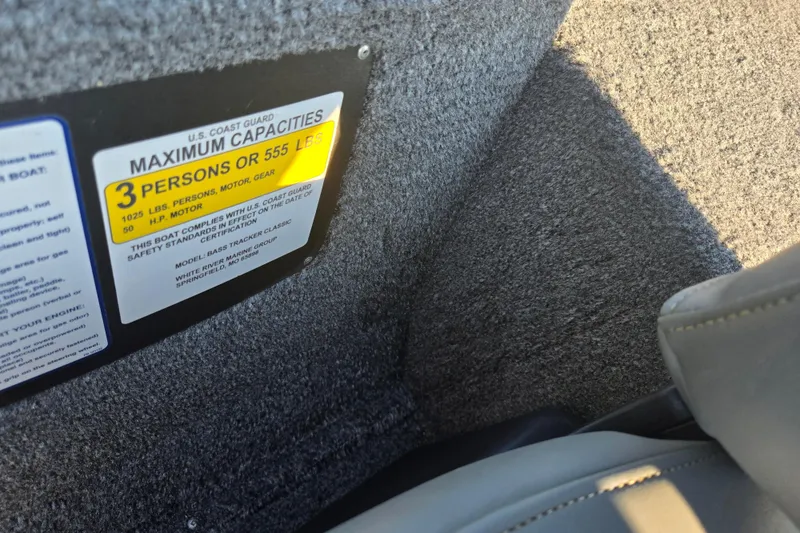 Slide: The Image of 2023 Tracker Bass Tracker Classic XL capacity label, showing maximum of 3 persons or 555 lbs. - 12