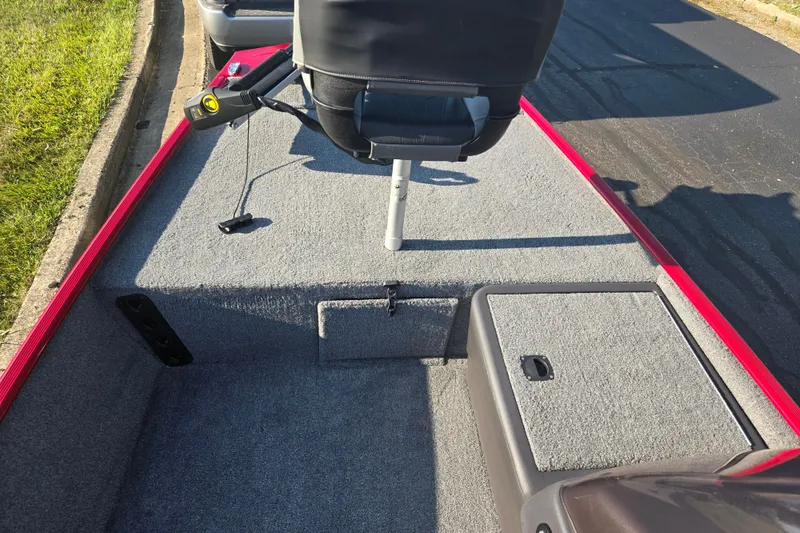 Slide: The Image of 2023 Tracker Bass Tracker Classic XL boat interior with gray carpet and seating. - 14
