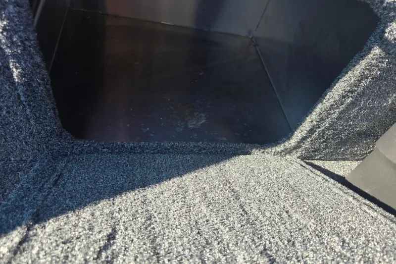 Slide: The Image of Interior view of 2023 Tracker Bass Tracker Classic XL boat storage compartment. - 16