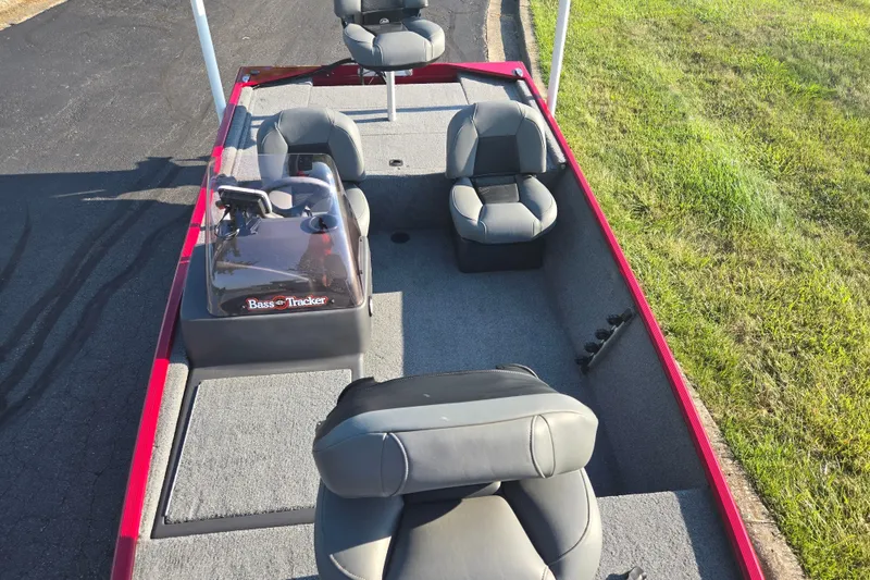 Slide: The Image of 2023 Tracker Bass Tracker Classic XL boat interior with seating and steering console. - 18