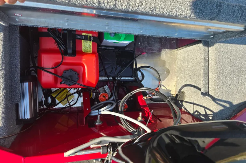 Slide: The Image of 2023 Tracker Bass Tracker Classic XL boat interior showing fuel tank and wiring. - 23