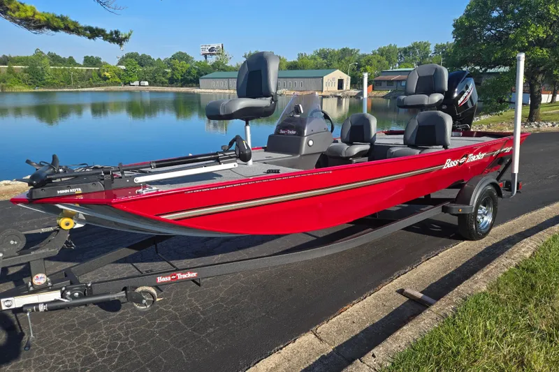 Slide: The Image of 2023 Tracker Bass Tracker Classic XL boat on trailer by a lake. - 9