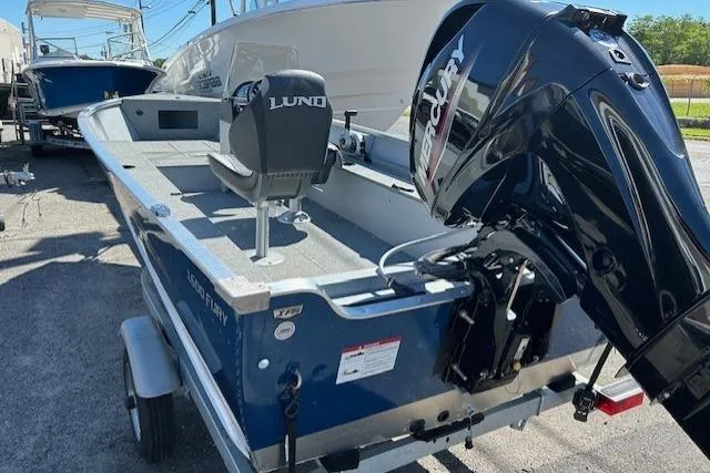 Slide: The Image of 2026 Lund 1600 Fury SS boat with Mercury outboard motor on trailer. - 4