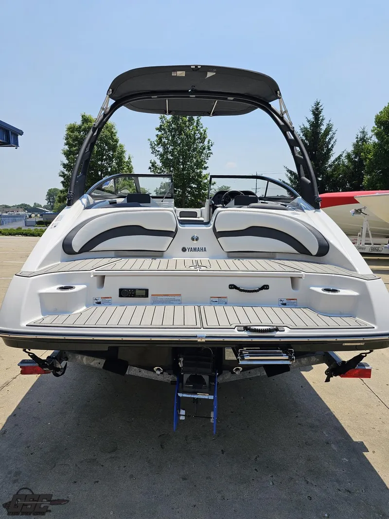 Slide: The Image of 2022 Yamaha Boats 195S, rear view, showcasing sleek design and spacious deck. - 26