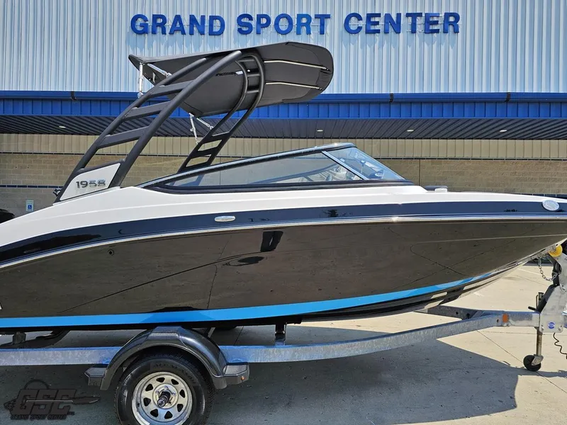 Slide: The Image of 2022 Yamaha Boats 195S at Grand Sport Center, sleek design on trailer. - 3