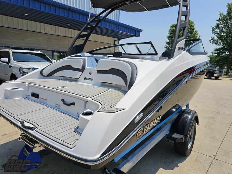Slide: The Image of 2022 Yamaha Boats 195S on trailer, sleek design, outdoor setting. - 30