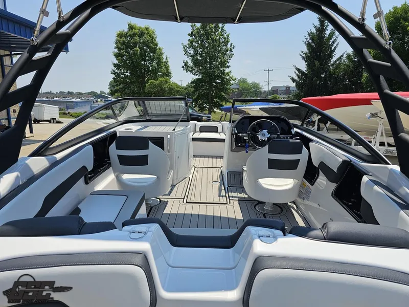 Slide: The Image of 2022 Yamaha Boats 195S interior, featuring sleek seating and modern dashboard design. - 34