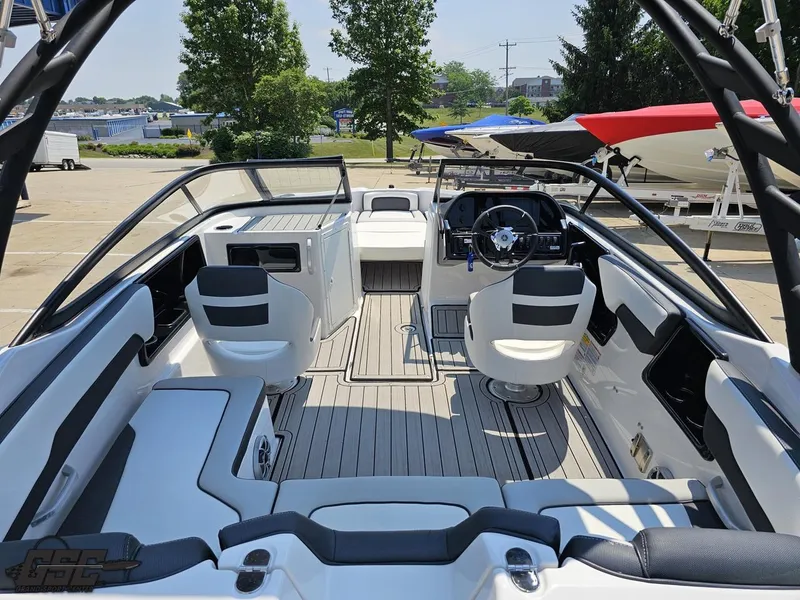 Slide: The Image of 2022 Yamaha Boats 195S interior, featuring sleek seating and modern dashboard design. - 36
