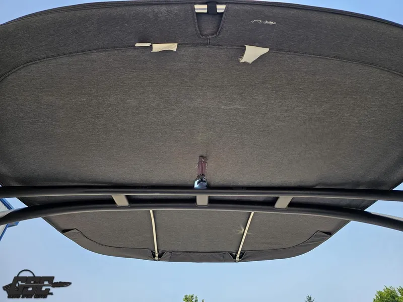 Slide: The Image of Damaged canopy of 2022 Yamaha Boats 195S, showing tears and wear. - 37