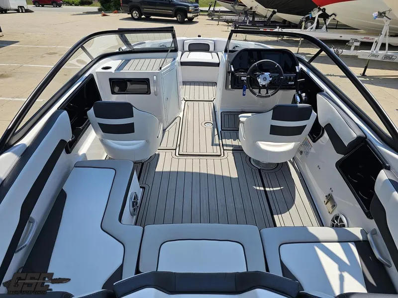 Slide: The Image of Interior of a 2022 Yamaha Boats 195S, featuring sleek seating and modern dashboard. - 38