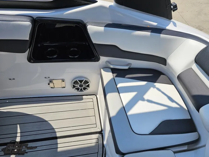 Slide: The Image of 2022 Yamaha Boats 195S interior with seating, cup holders, and speaker. - 39