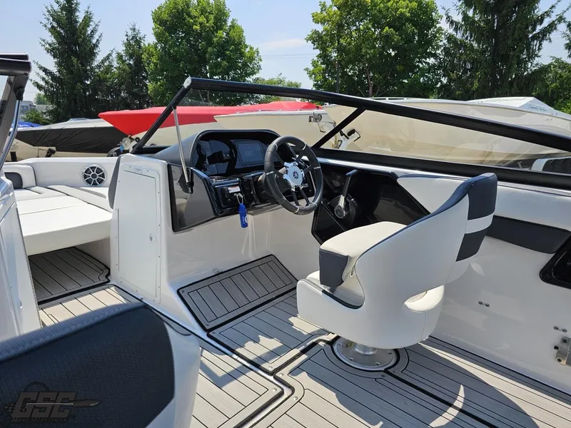 Slide: The Image of 2022 Yamaha Boats 195S interior with sleek dashboard and comfortable seating. - 41
