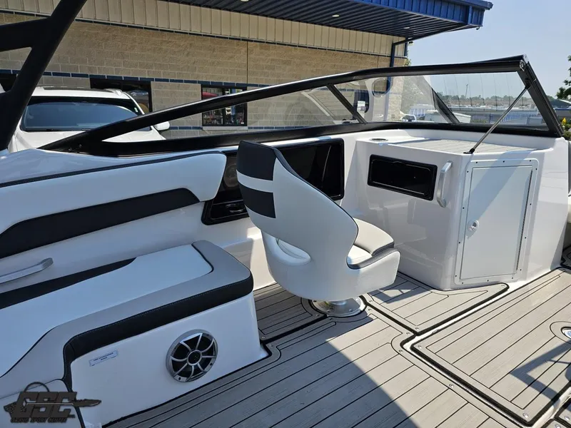 Slide: The Image of 2022 Yamaha Boats 195S interior with sleek seating and modern dashboard design. - 43