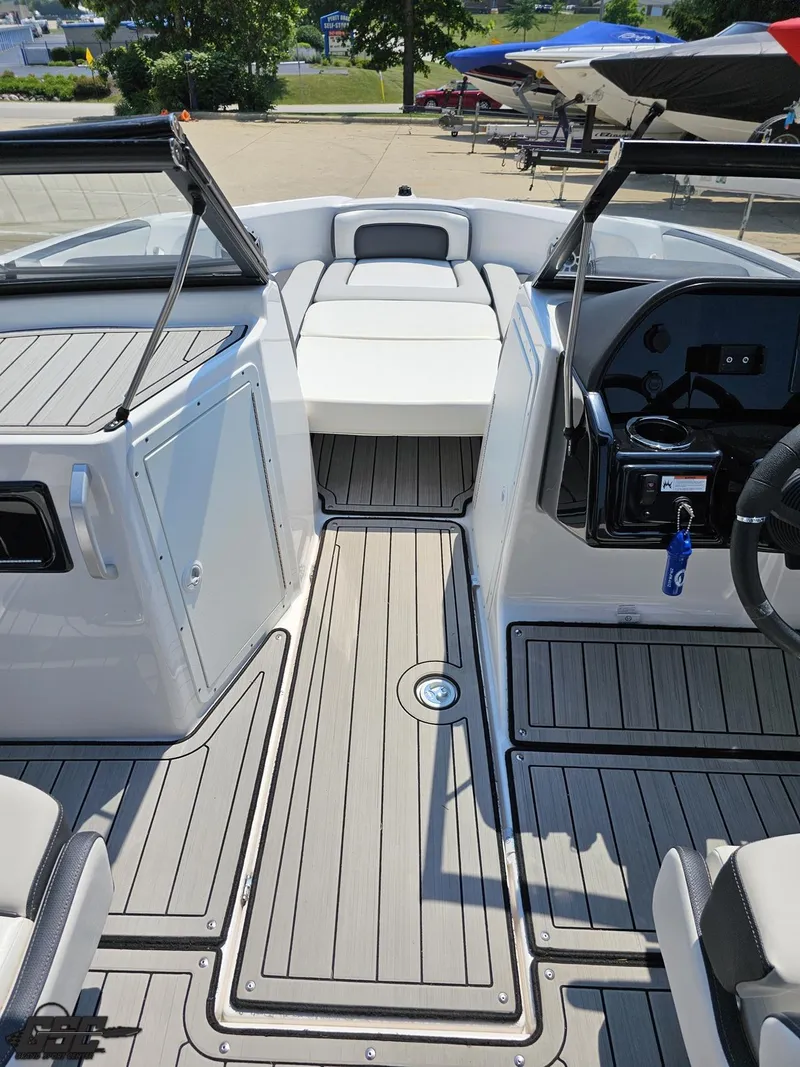 Slide: The Image of 2022 Yamaha Boats 195S interior with sleek seating and modern dashboard design. - 44
