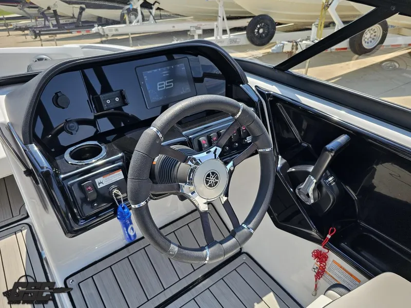Slide: The Image of 2022 Yamaha Boats 195S dashboard with steering wheel and control panel. - 48