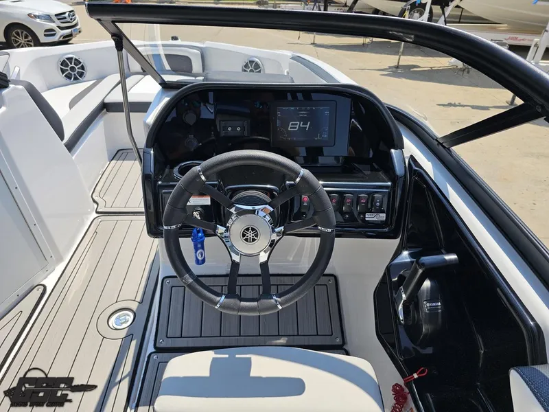 Slide: The Image of 2022 Yamaha Boats 195S dashboard with steering wheel and digital display. - 49
