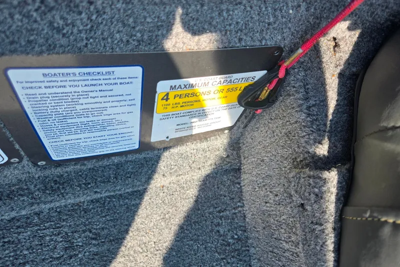 Slide: The Image of 2023 Tracker Pro Team 175 TXW boat capacity and safety checklist label. - 13