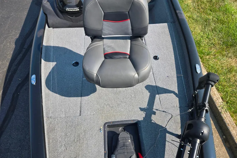 Slide: The Image of 2023 Tracker Pro Team 175 TXW boat interior with seat and trolling motor. - 19