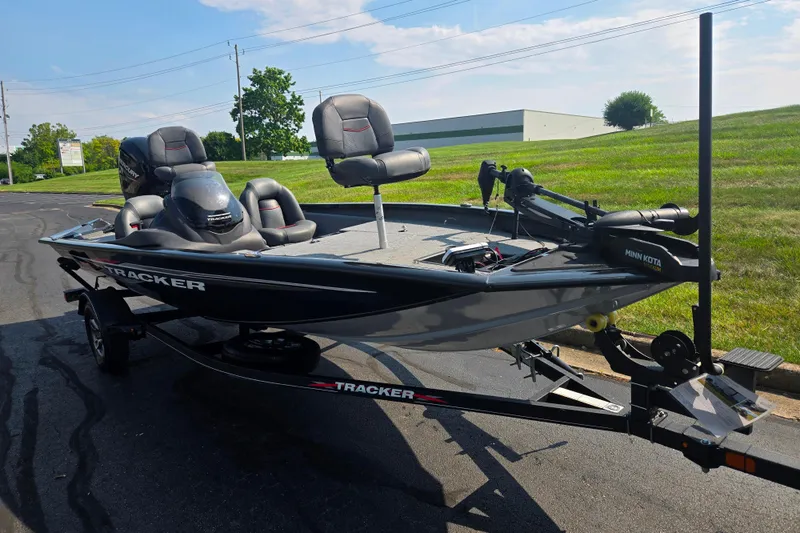 Slide: The Image of 2023 Tracker Pro Team 175 TXW fishing boat on trailer, parked outdoors. - 5