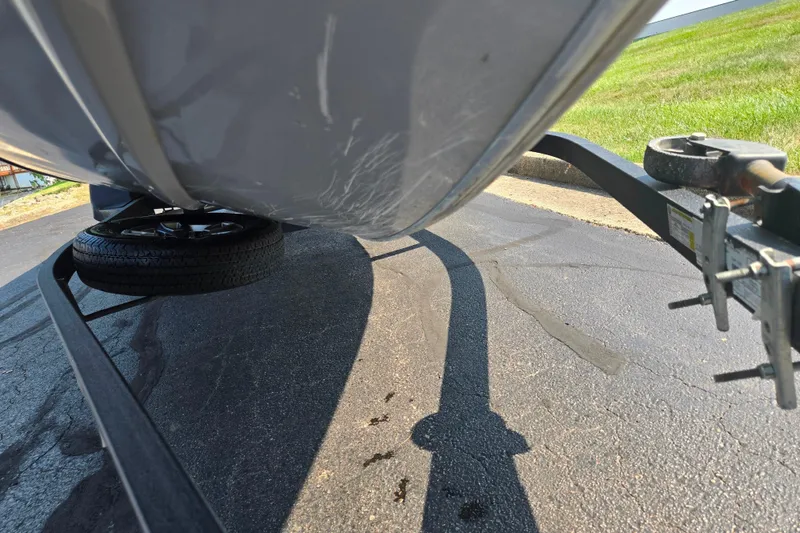 Slide: The Image of 2023 Tracker Pro Team 175 TXW boat on trailer, close-up view. - 7