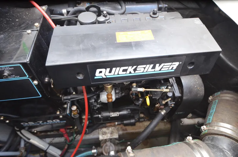 Slide: The Image of Engine compartment of a 1990 Sea Ray 350 Sundancer Coupe with Quicksilver components. - 25