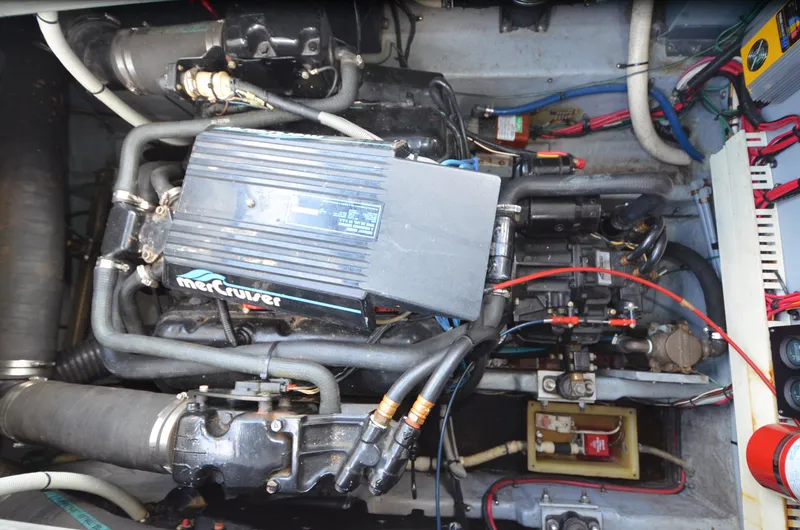 Slide: The Image of Engine compartment of 1990 Sea Ray 350 Sundancer Coupe with MerCruiser components. - 26
