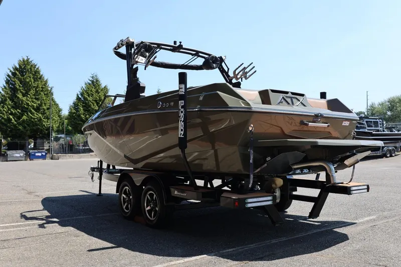 Slide: The Image of 2023 ATX Surf Boats 22 Type-S on trailer, parked outdoors. - 11