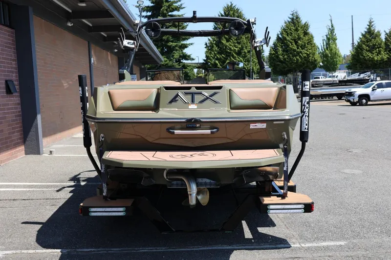 Slide: The Image of 2023 ATX Surf Boats 22 Type-S, rear view, parked outdoors, showcasing sleek design and features. - 12