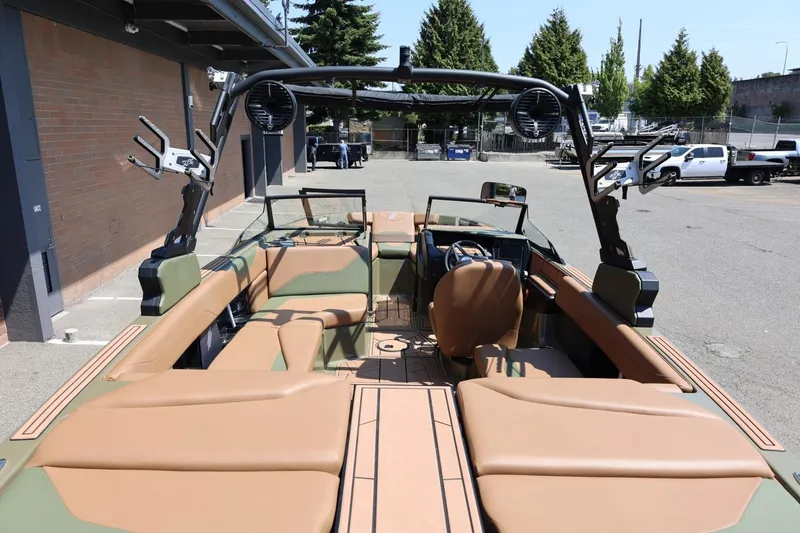 Slide: The Image of 2023 ATX Surf Boats 22 Type-S interior with tan seating and modern design. - 18