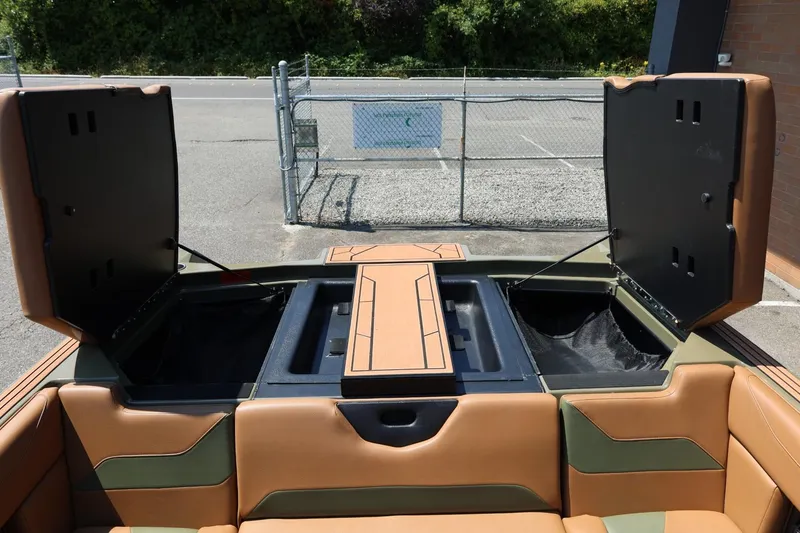 Slide: The Image of 2023 ATX Surf Boats 22 Type-S interior storage compartments open, showcasing spacious design. - 21