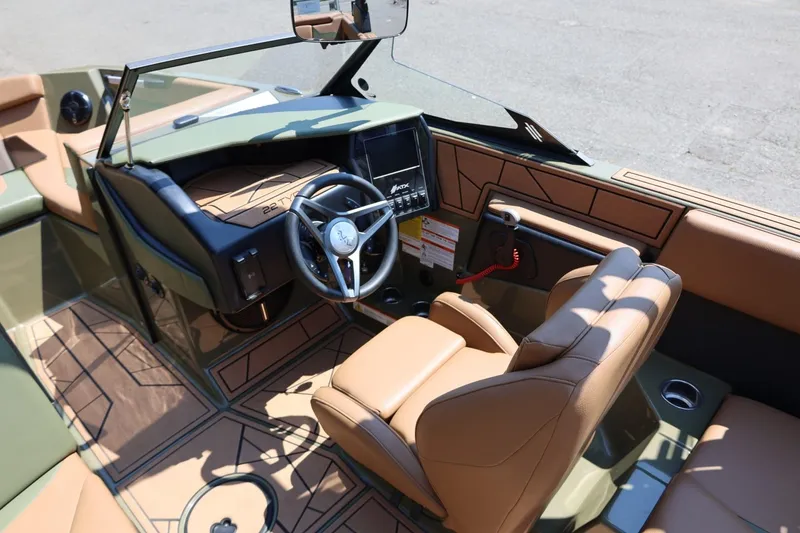 Slide: The Image of 2023 ATX Surf Boats 22 Type-S interior with tan seats and modern dashboard. - 28