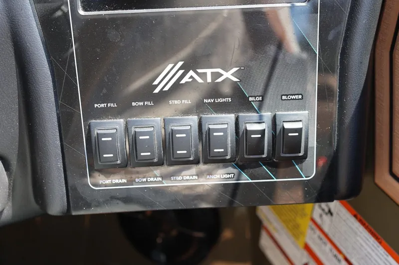Slide: The Image of Control panel of 2023 ATX Surf Boats 22 Type-S with various switches. - 30