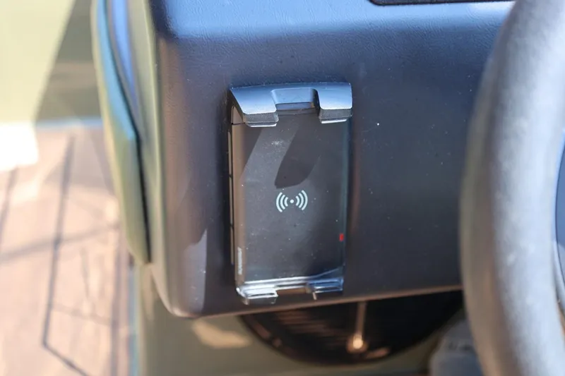 Slide: The Image of 2023 ATX Surf Boats 22 Type-S dashboard with wireless charging pad. - 31