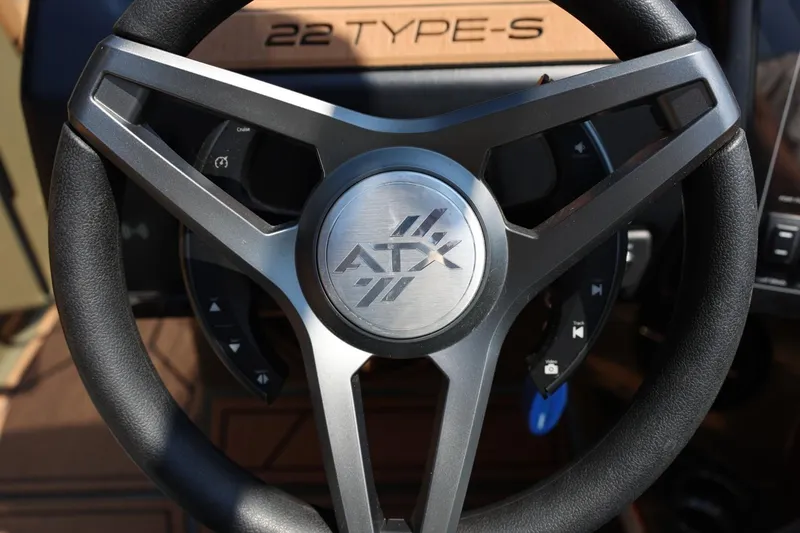 Slide: The Image of Steering wheel of 2023 ATX Surf Boats 22 Type-S, featuring sleek design and controls. - 33