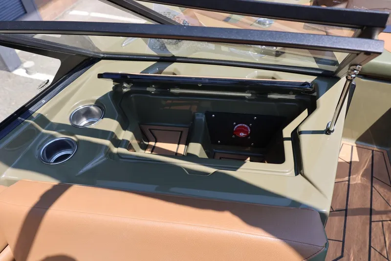 Slide: The Image of 2023 ATX Surf Boats 22 Type-S dashboard with cup holders and storage compartment. - 40