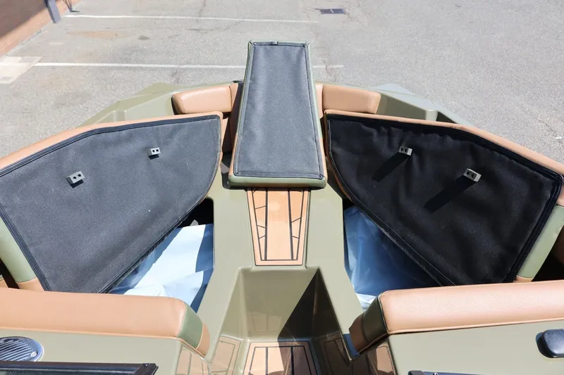Slide: The Image of 2023 ATX Surf Boats 22 Type-S bow storage compartments open, showcasing interior space. - 45