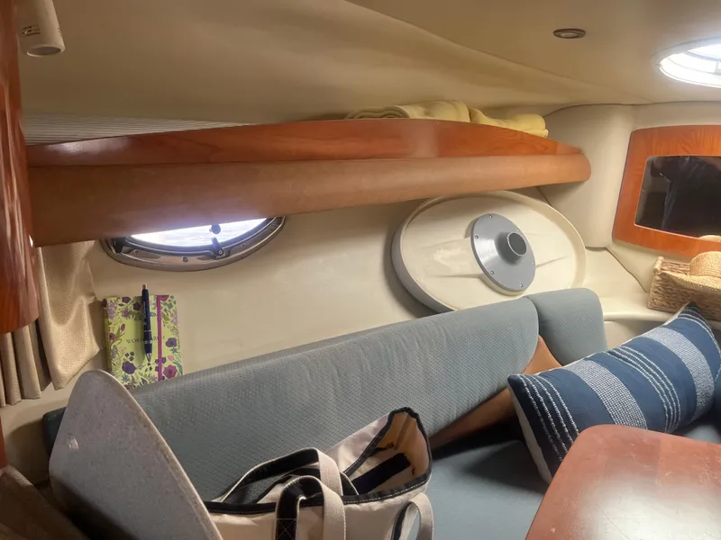 Slide: The Image of Interior of 2007 Four Winns 258 Vista boat with cozy seating and nautical decor. - 15