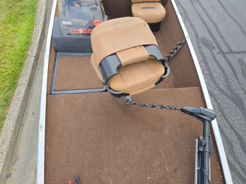 Slide: The Image of 2018 Tracker Bass Tracker 40th Anniversary Heritage Edition boat interior with tan seats and trolling motor. - 16